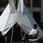 Person next to tipi